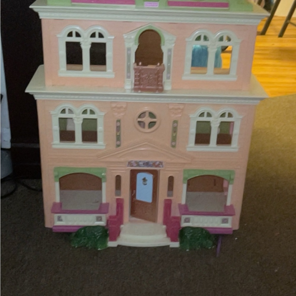 Colorful Dollhouse with Pink and Green Accents